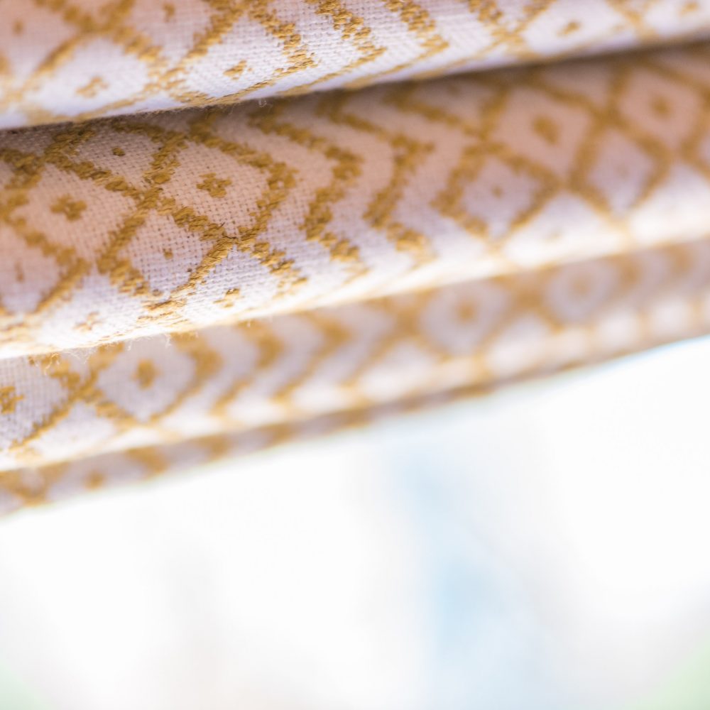 yellow patterned blinds close up