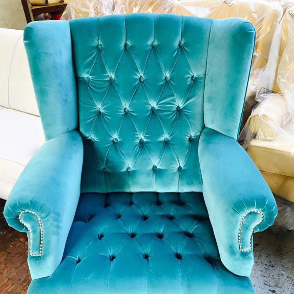 upholstered blue arm chair