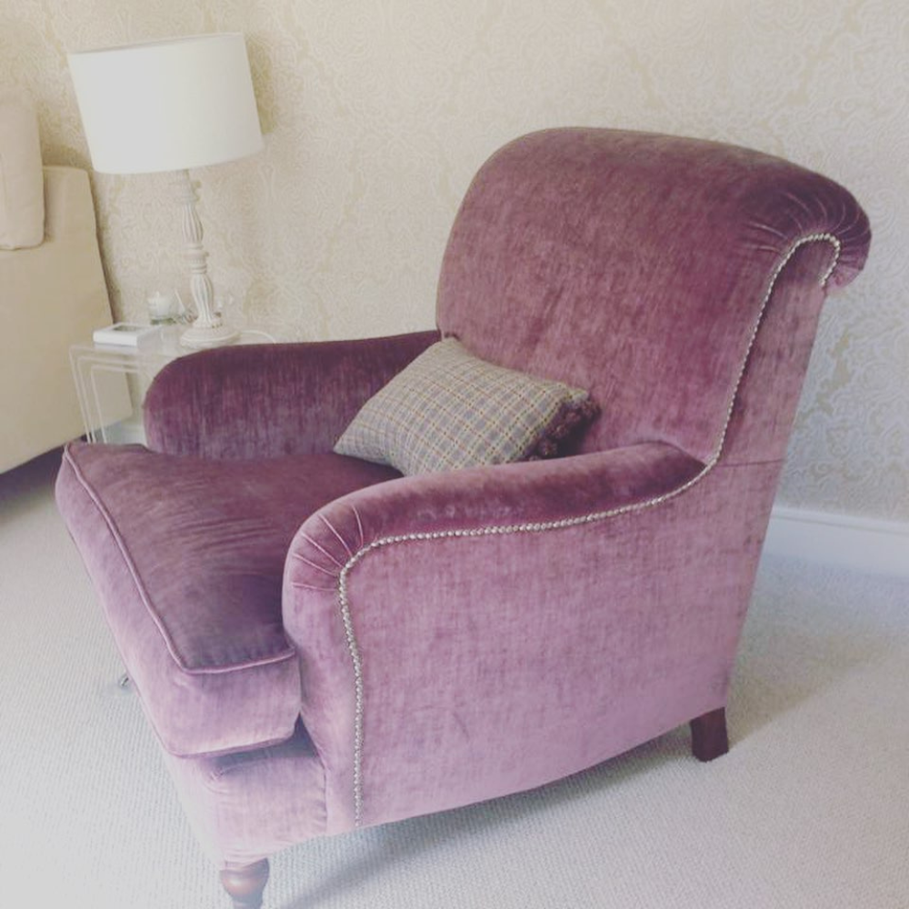 upholstered violet arm chair with cushion